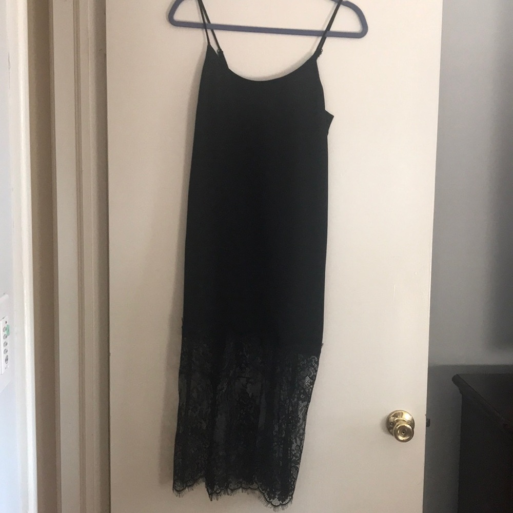 Black midi strap dress with lace at bottom